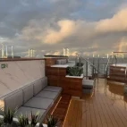 The outside deck with pool and hot tub, on Ocean Victory.