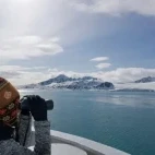 Admiring the polar landscape with a pair of binoculars, Svalbard.
