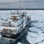 Explorer navigating icy waters in the Arctic.