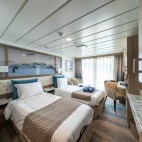 Balcony stateroom on board Greg Mortimer.