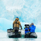 Wildlife photographers on a Zodiac in Svalbard