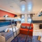 Quadruple porthole cabin on board Hondius polar vessel.