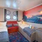 Twin porthole cabin on board Hondius polar vessel.