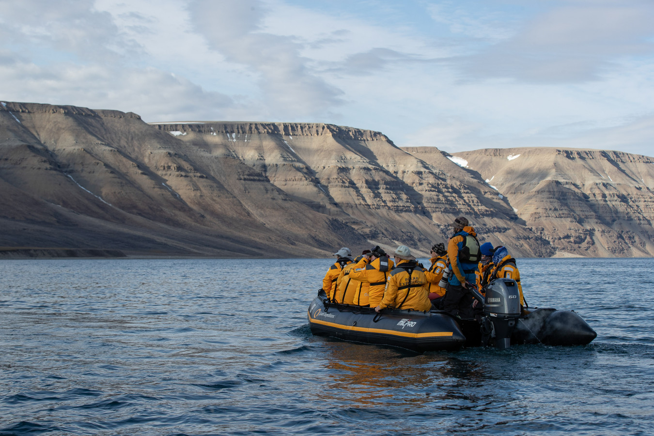 Zodiak with guests off exploring in the Arctic.