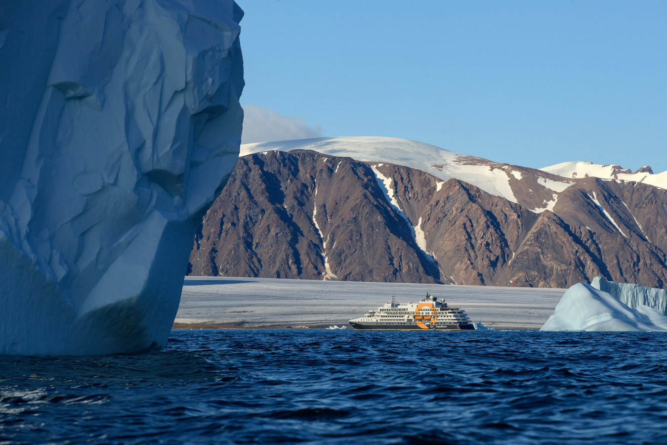 The vessel Ultramarine amongst the Arctic landscape.