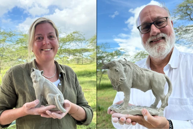 Two clients with their sculptures, on Ndutu Wildlife Art Safari. Tanzania.