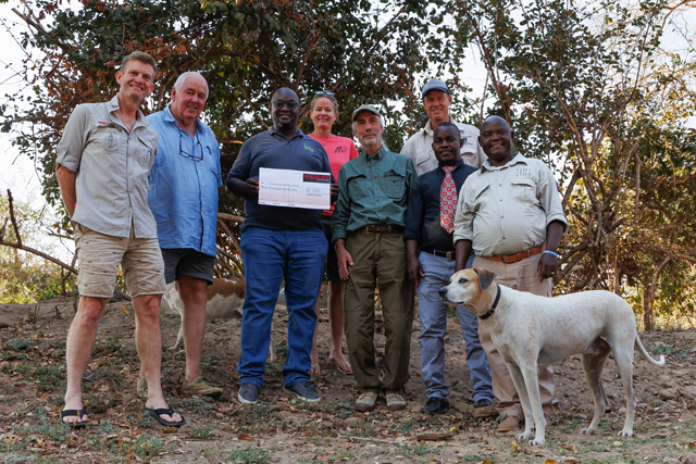 Presenting a cheque to Conservation South Luangwa in Zambia