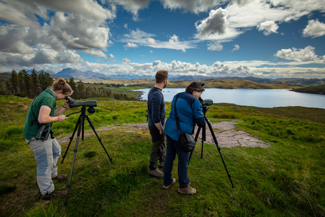 Group birdwatching in the Scottish Highlands.