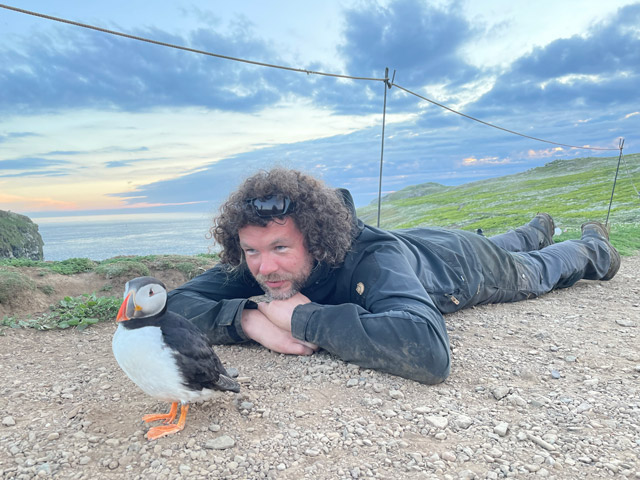 Kev Morgans and an Atlantic puffin in Skomer.