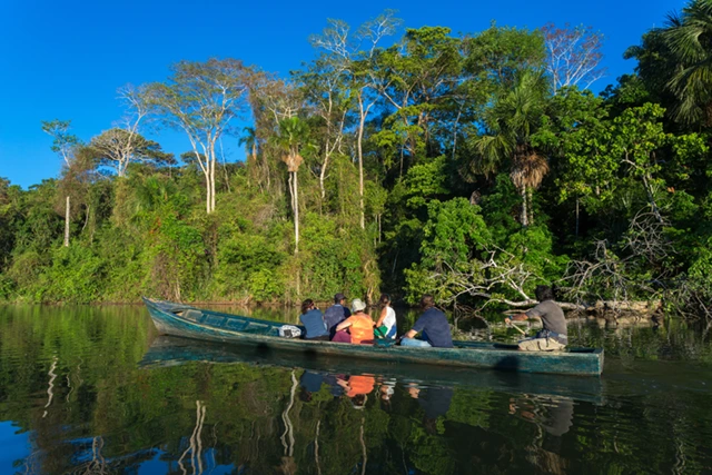 Canoe in the Amazon Rainforest, Tambopata National Park, Peru