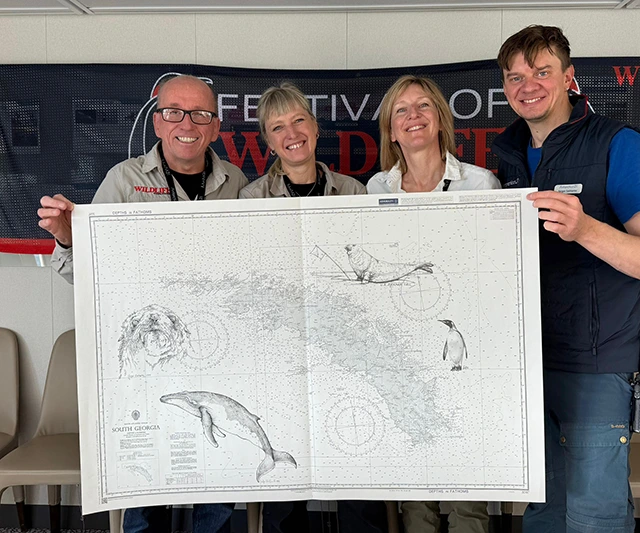 Wildlife artists presenting the ship chart auction prize on Wildlife Worldwide's Festival of Wildlife